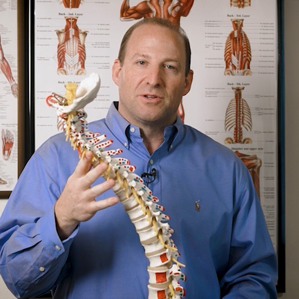 spine-model Dr. Jason Kaufman demonstrates a spine model at ChiroPath in Scottsdale, AZ
